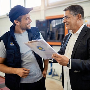 berintek garage door repair happy repairman with customer in kanata