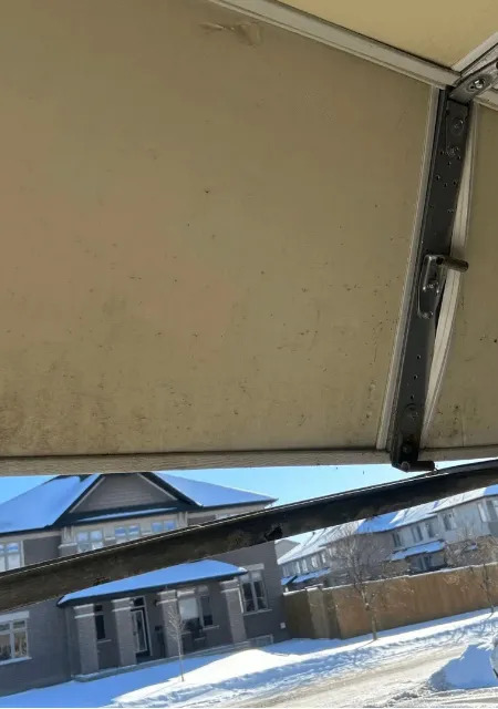 professional technicians installing garage door in kanata