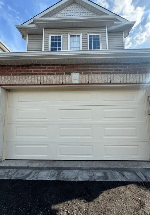 professional technicians repairing garage door in kanata
