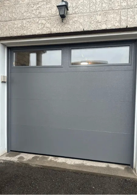 technician repairing garage door in ottawa