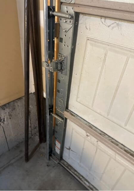 broken garage door brackets and hinges that need replacing