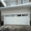 white modern double garage door with windows