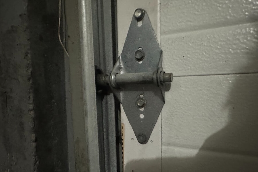 checking garage door rollers and tracks
