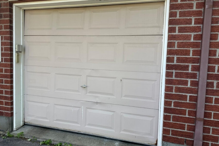 restoring a damaged garage door with bowing